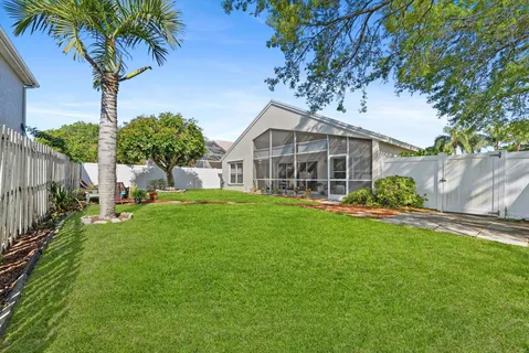 a view of a backyard with sitting area