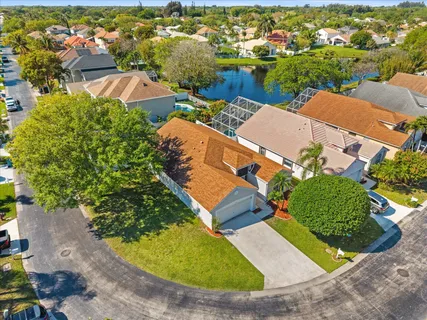 an aerial view of a house with yard swimming pool and outdoor seating