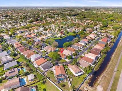 an aerial view of residential houses with outdoor space