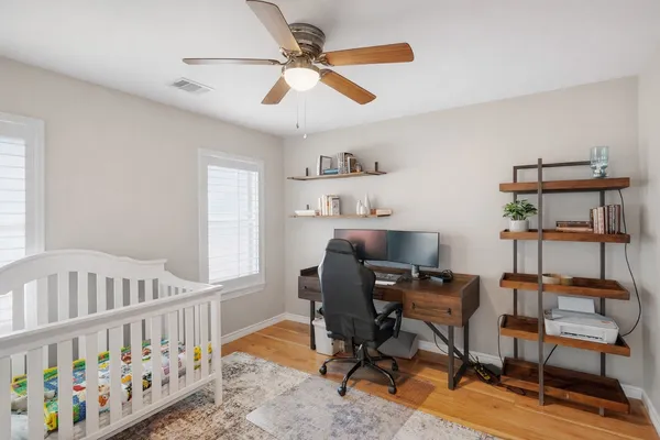 a bedroom with furniture and a window