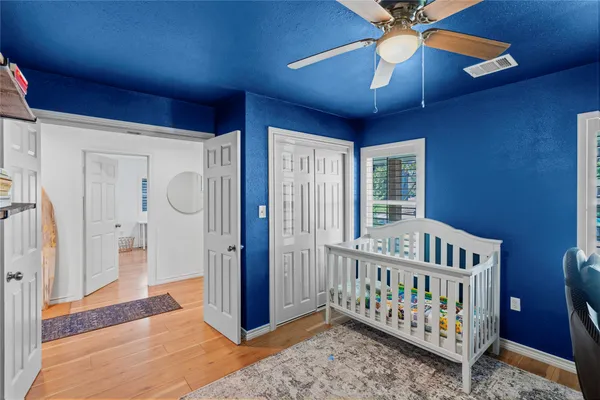 a bedroom with furniture and a chandelier