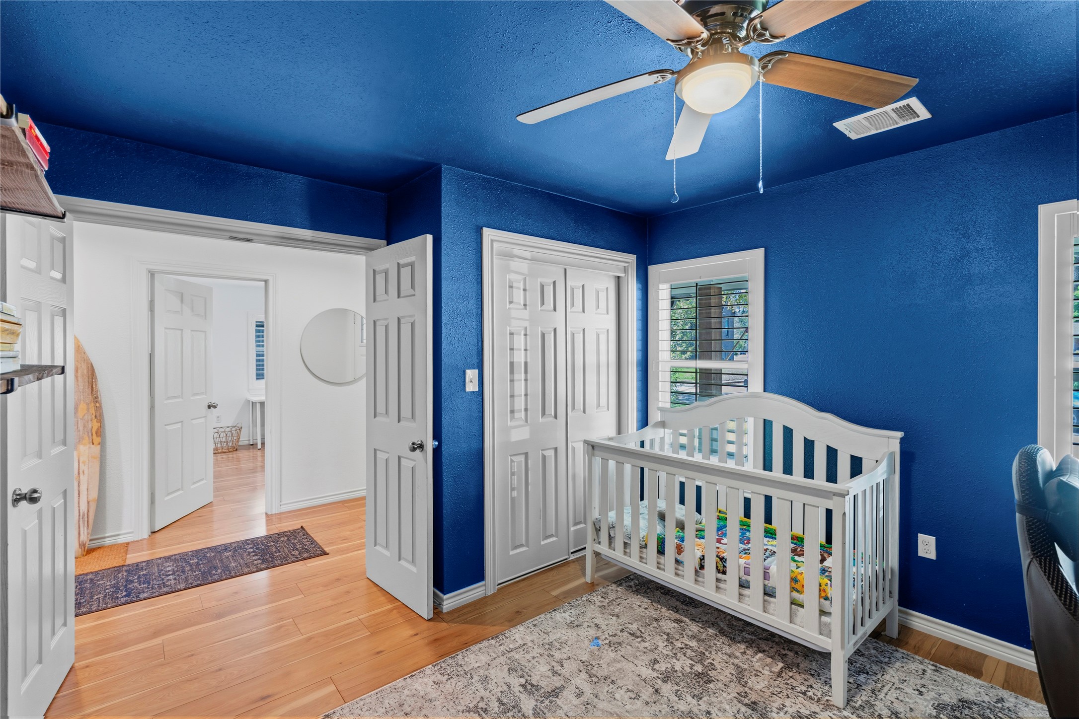 102 Enchanted Oaks Court Spring, TX 77388 - Photo 13 of 48 a bedroom with furniture and a chandelier