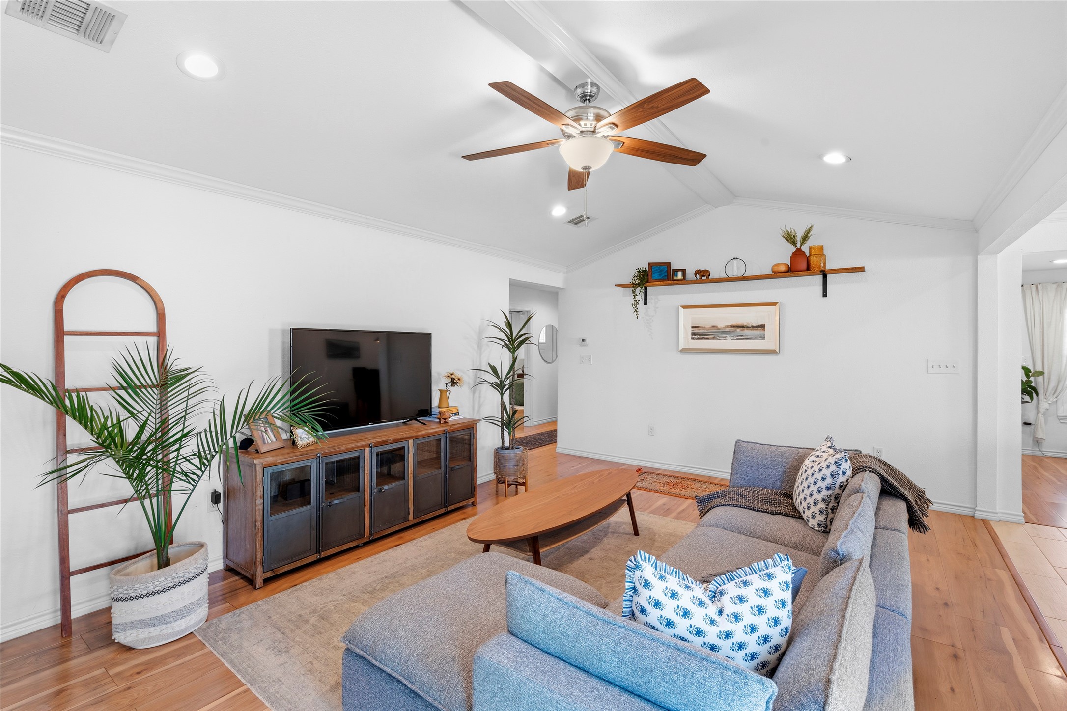 102 Enchanted Oaks Court Spring, TX 77388 - Photo 16 of 48 a living room with furniture and a flat screen tv