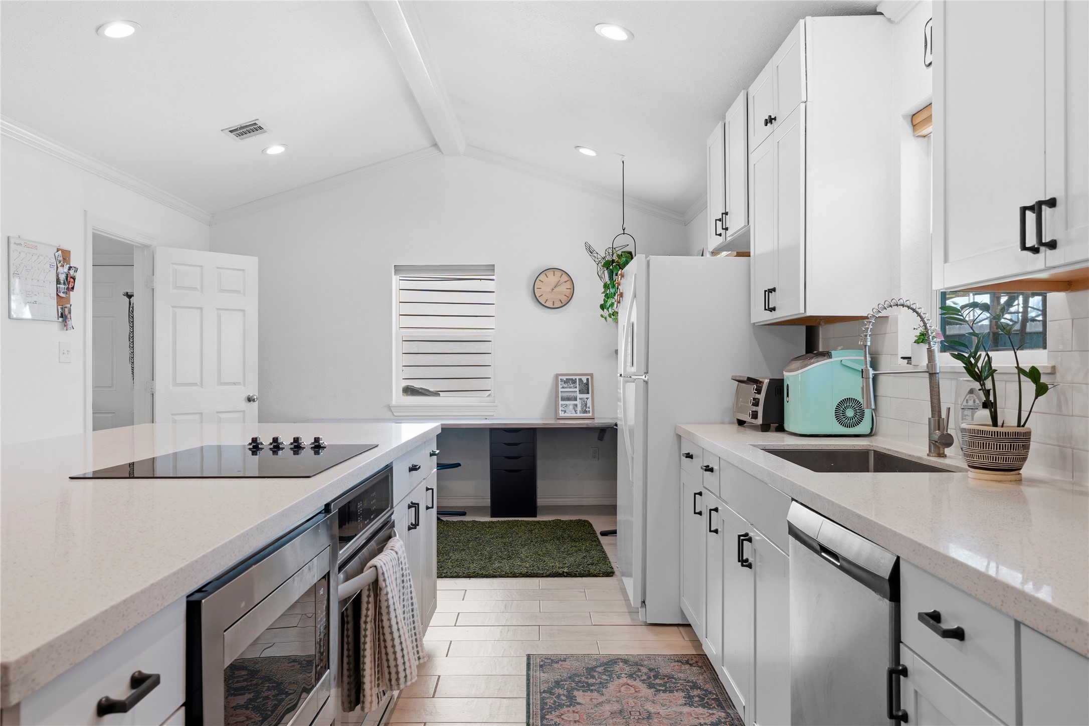 102 Enchanted Oaks Court Spring, TX 77388 - Photo 21 of 48 a kitchen with stainless steel appliances granite countertop a sink and stove