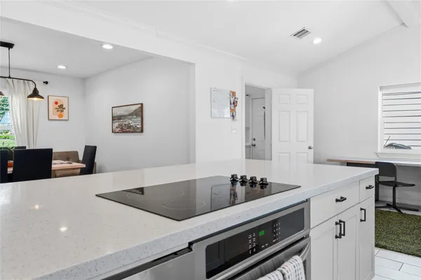 a kitchen with stainless steel appliances granite countertop a sink and stove