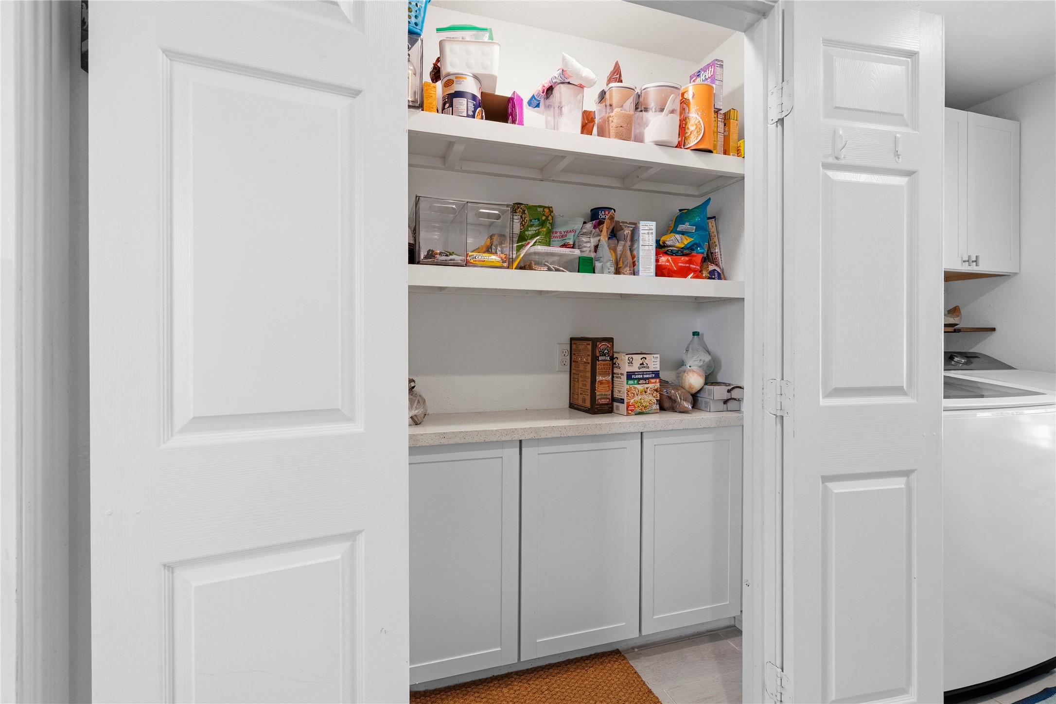 102 Enchanted Oaks Court Spring, TX 77388 - Photo 26 of 48 a cabinet with white cabinets and wooden floor