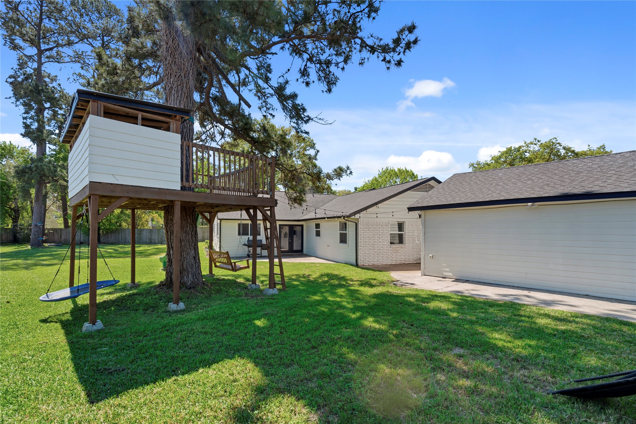 102 Enchanted Oaks Court Spring, TX 77388 - Photo 28 of 48 a view of house with a big yard potted plants and large tree
