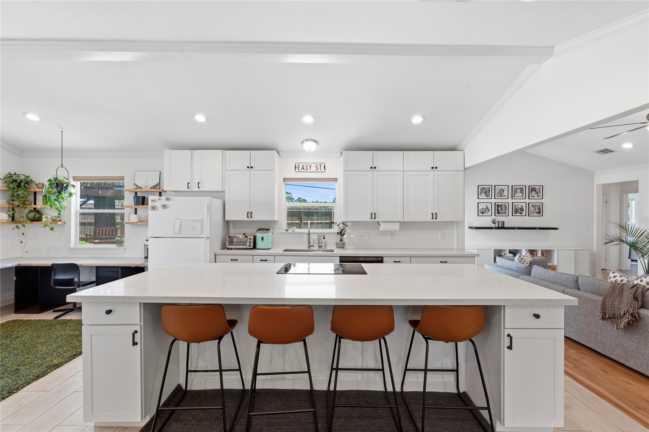 102 Enchanted Oaks Court Spring, TX 77388 - Photo 3 of 48 a kitchen with stainless steel appliances granite countertop a table chairs sink and cabinets