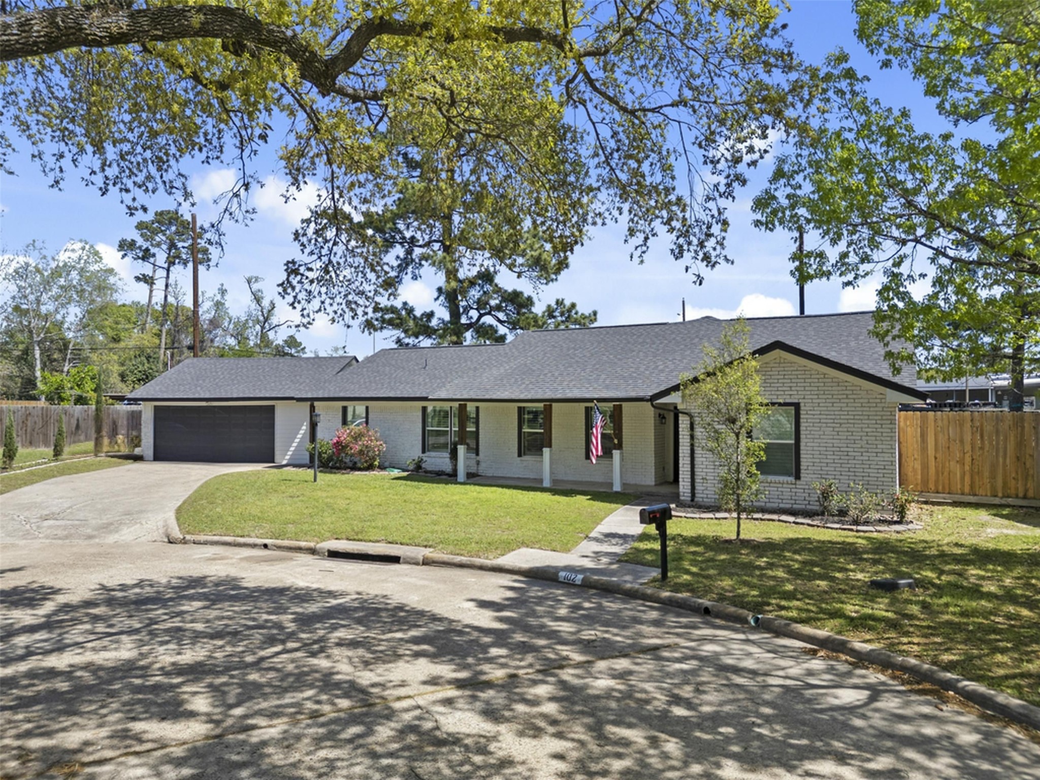 102 Enchanted Oaks Court Spring, TX 77388 - Photo 43 of 48 a front view of a house with a yard
