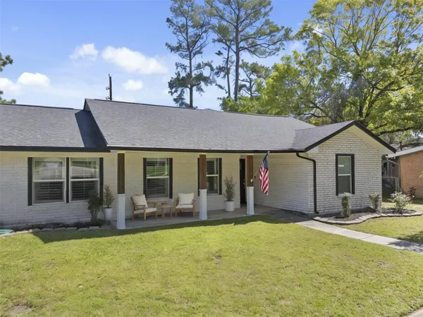 a front view of house with yard and seating