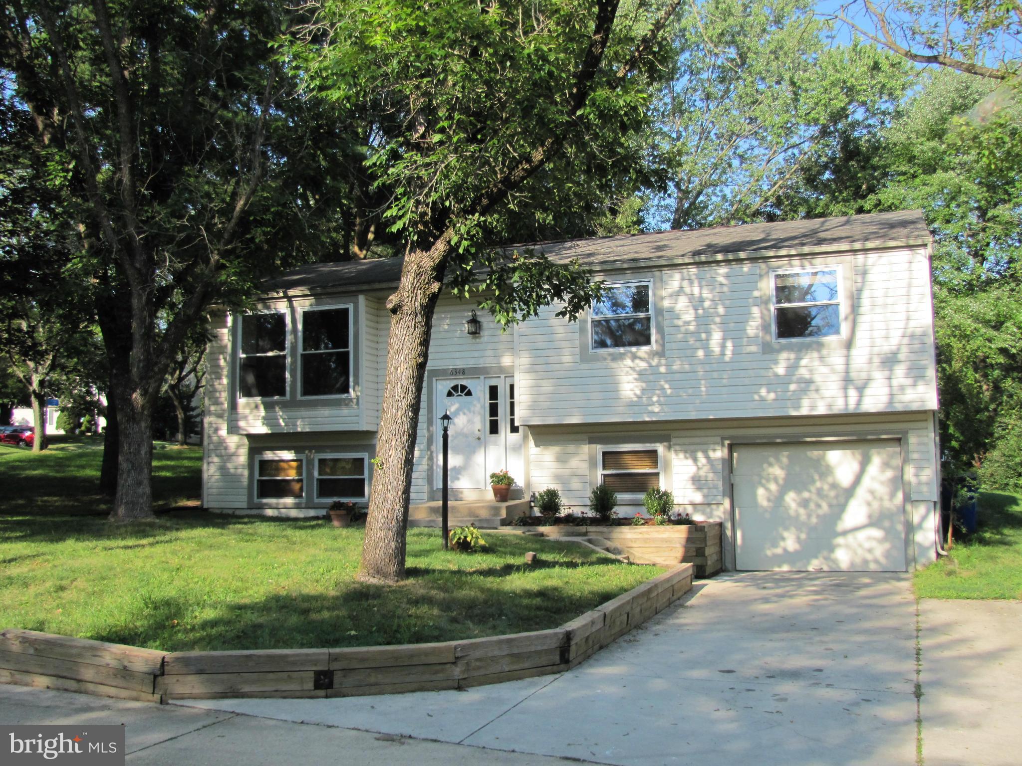 6348 Sandchain Road Columbia, MD 21045 - Photo 1 of 24 a front view of house with a garden
