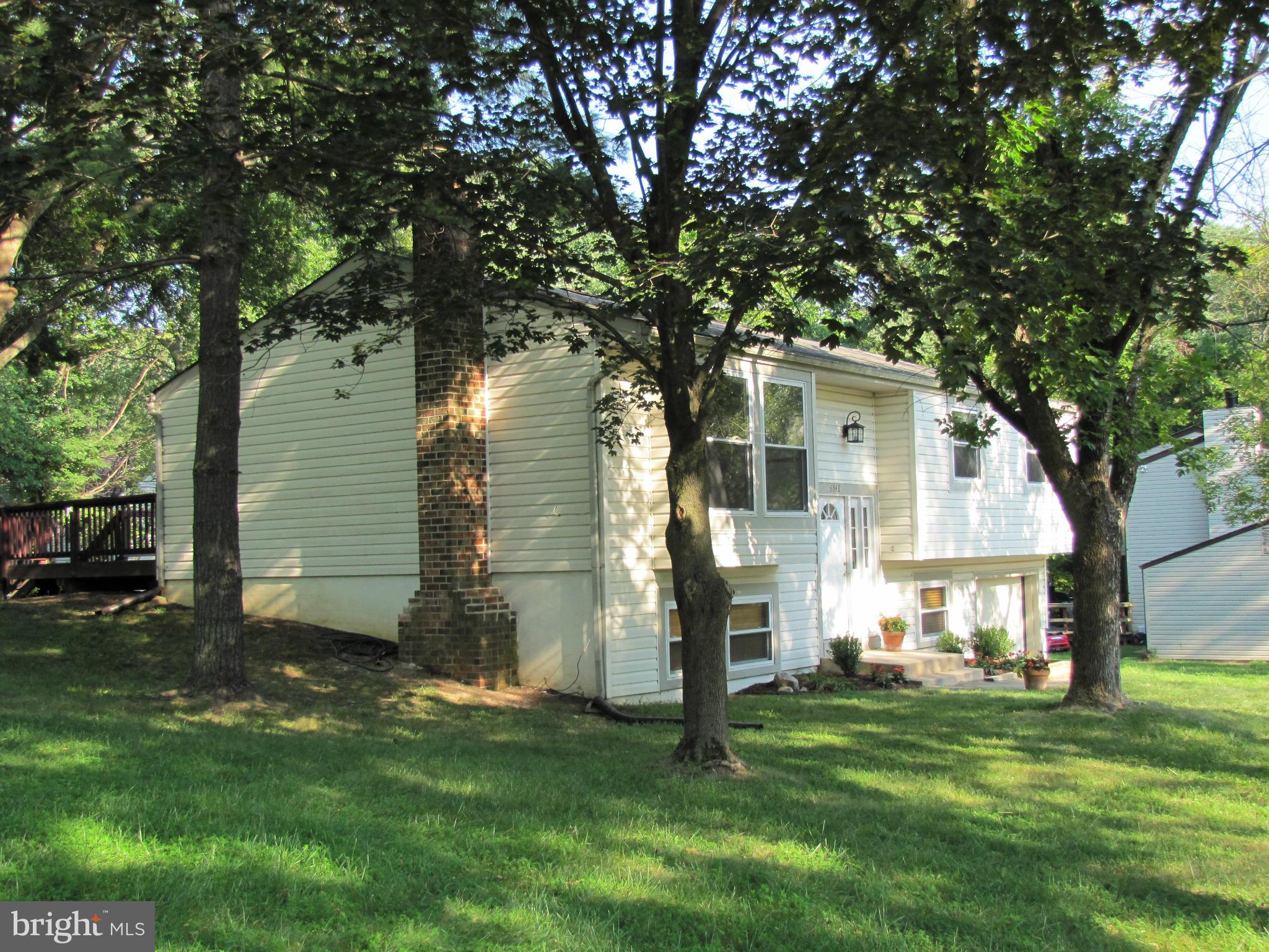 6348 Sandchain Road Columbia, MD 21045 - Photo 2 of 24 a view of a backyard with a large tree