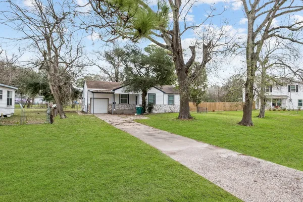 a view of a trees in front of a house