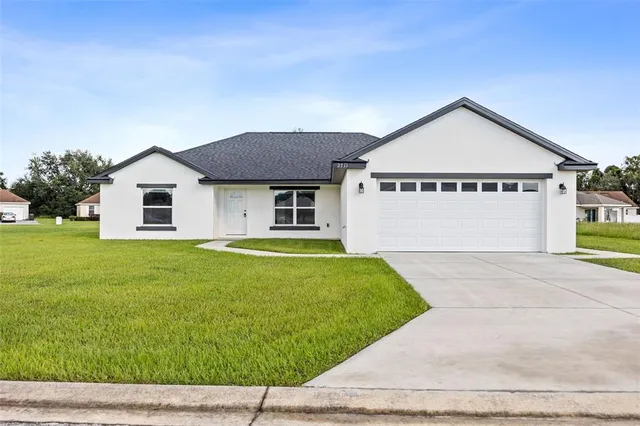 a view of front of house with a yard