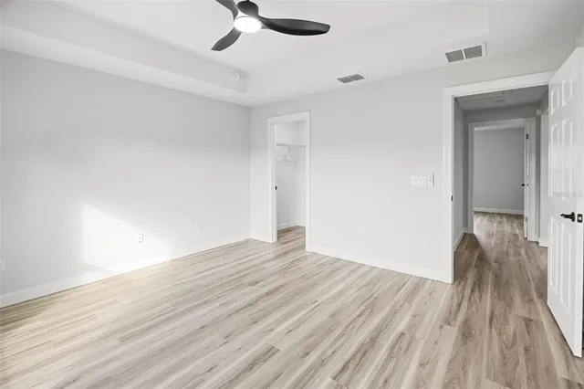 a spacious bathroom with a sink and vanity