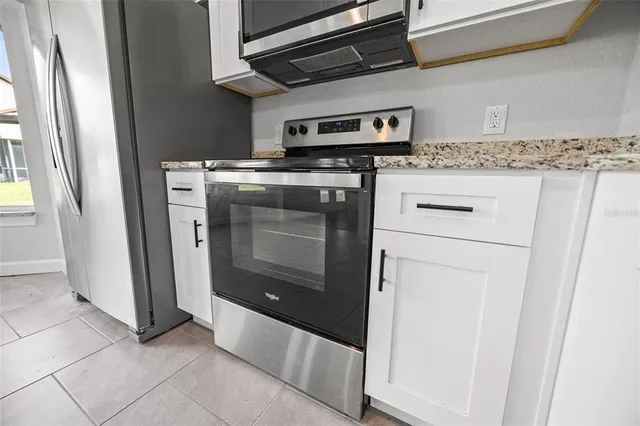 a view of a golf course with chairs