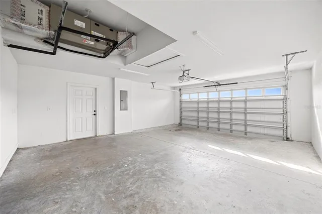 a front view of a house with yard and green space