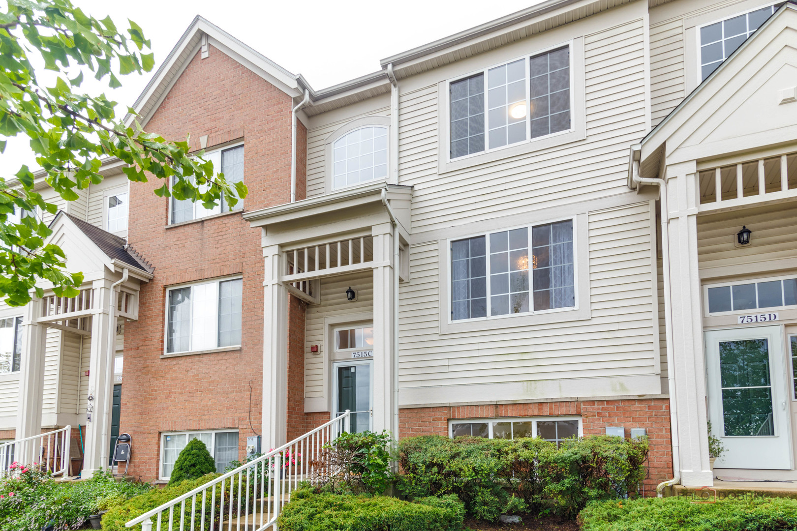 7515e Savoy Lane, Unit C Bridgeview, IL 60455 - Photo 1 of 22 a view of a house with a yard and potted plants