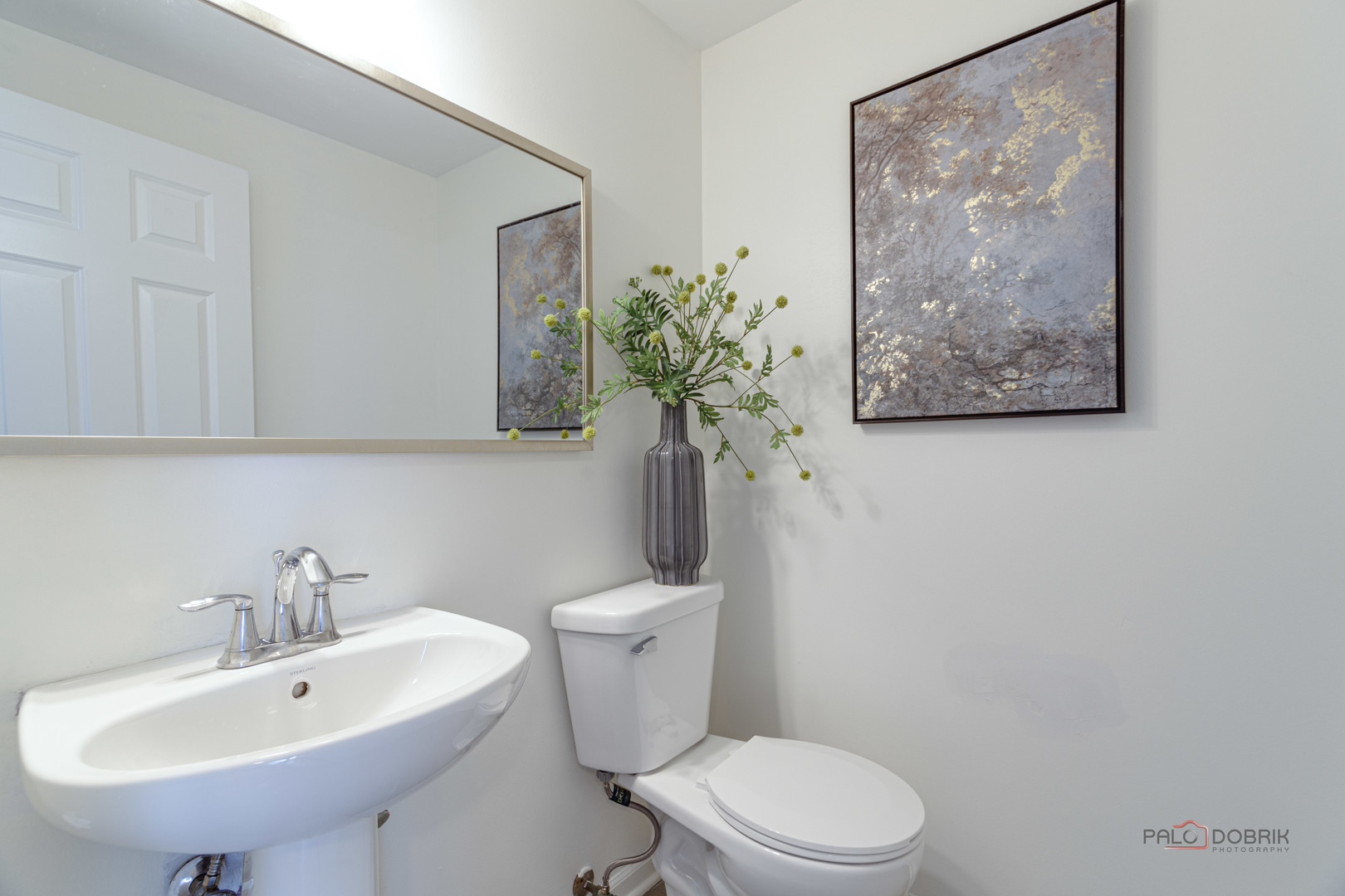 7515e Savoy Lane, Unit C Bridgeview, IL 60455 - Photo 12 of 22 a white toilet sitting next to a bathroom sink