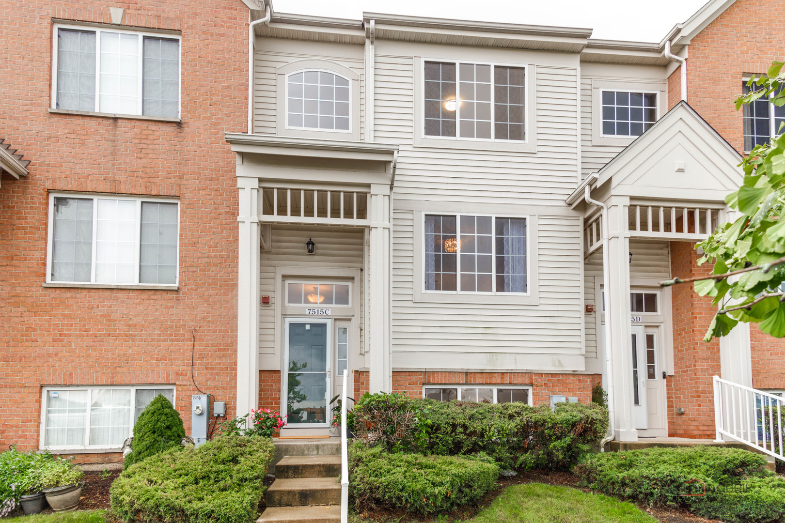 7515e Savoy Lane, Unit C Bridgeview, IL 60455 - Photo 2 of 22 a front view of a house with plants