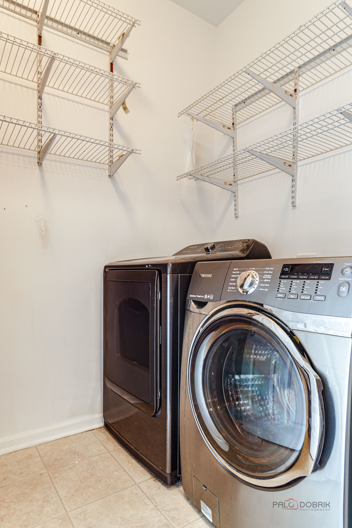 7515e Savoy Lane, Unit C Bridgeview, IL 60455 - Photo 21 of 22 a utility room with dryer and washer