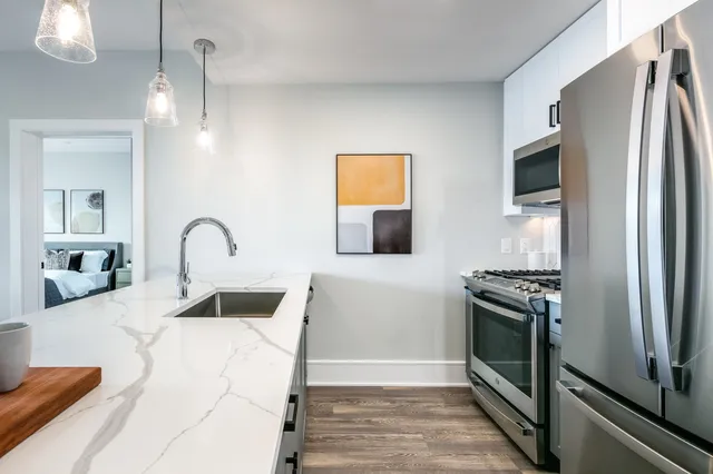 a spacious bedroom with a large bed and a window