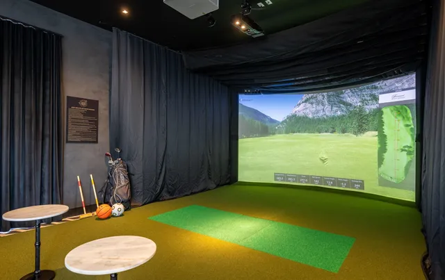 a living room with furniture and large windows