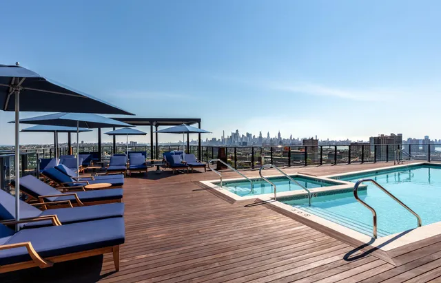 a view of a swimming pool with seating area