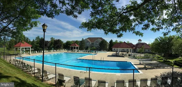 a view of a swimming pool with a lounge chairs