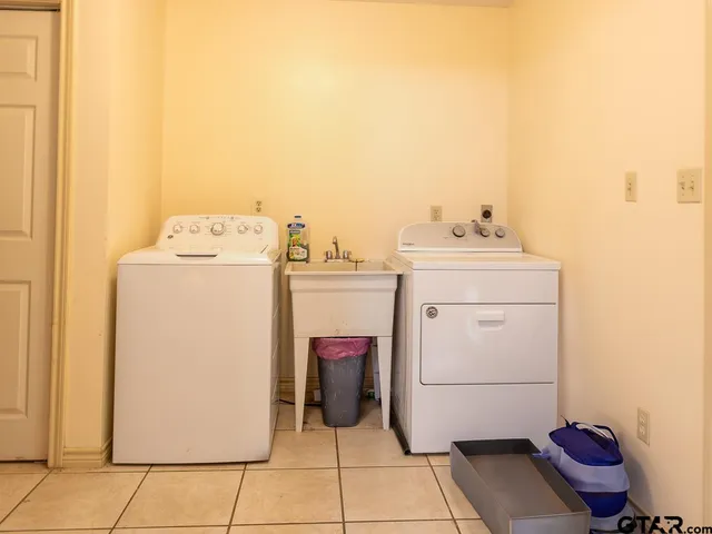 a utility room with dryer and washer