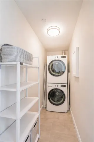 a utility room with sink dryer and washer