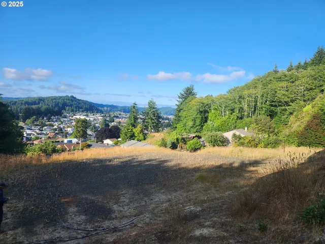 a view of a road with a building in the background