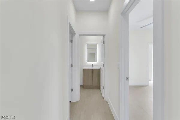 a view of a hallway with an entryway