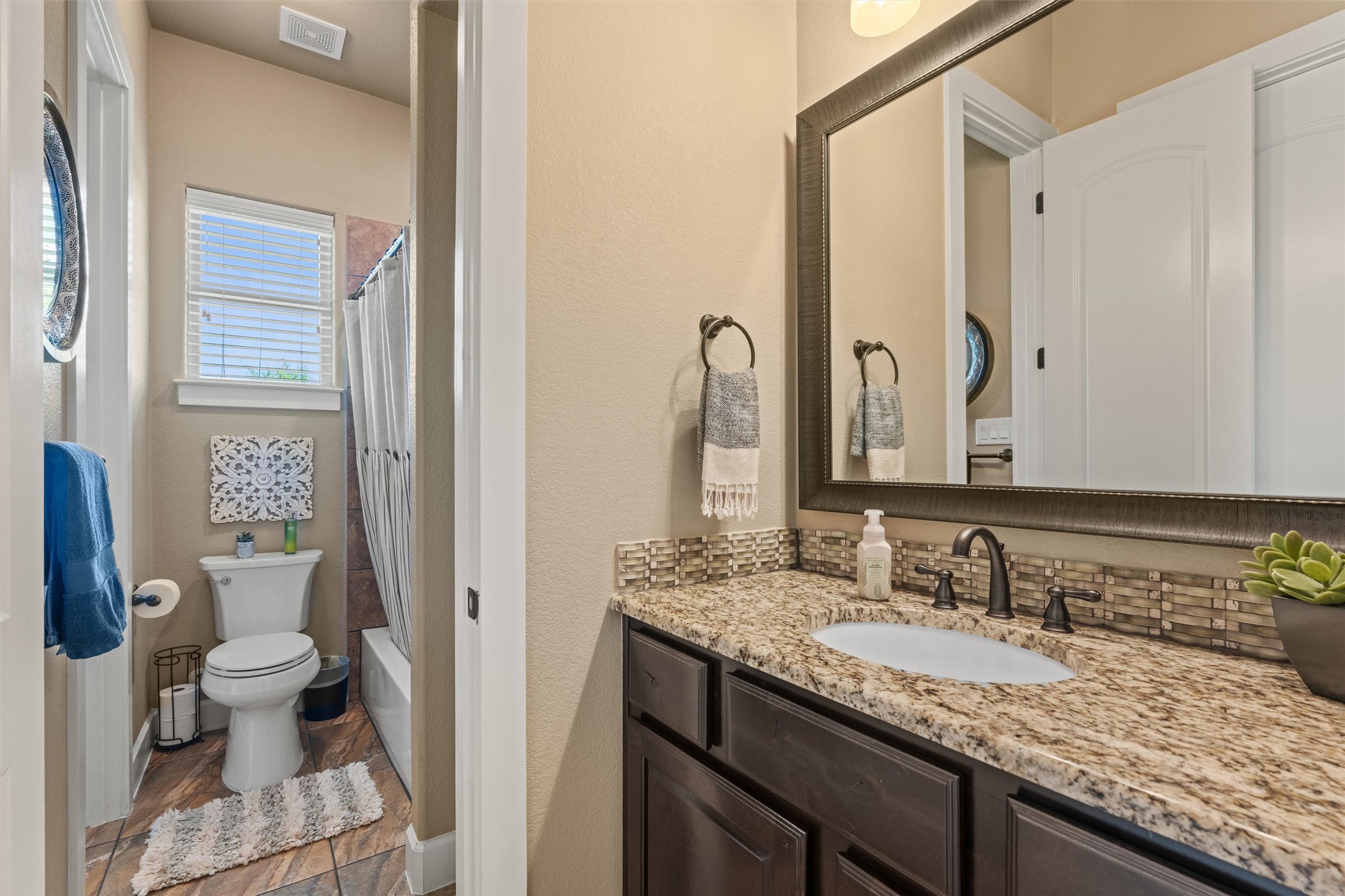 104 Adobe Cove Georgetown, TX 78633 - Photo 26 of 40 A well-appointed bathroom features granite counters and tile flooring.
