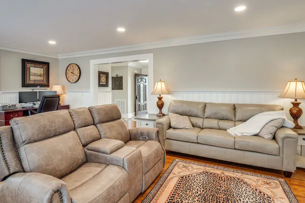 a living room with furniture and a rug