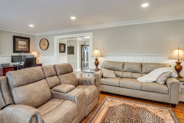 a living room with furniture and a rug