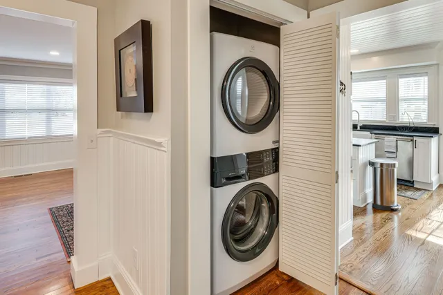 a view of a hallway with washer and dryer