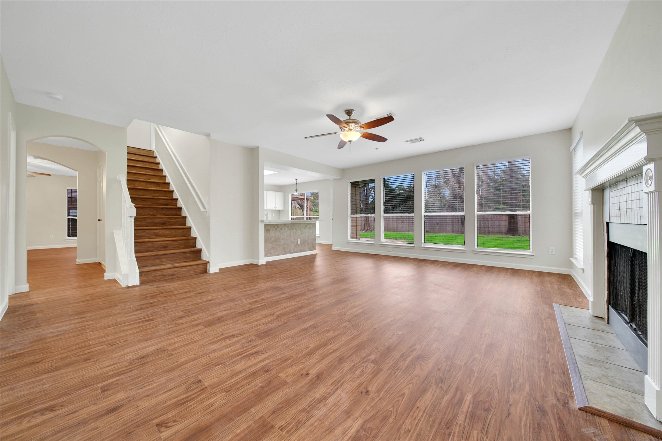 1427 Redwood Village Circle Spring, TX 77386 - Photo 18 of 43 a view of a livingroom with wooden floor and a fireplace