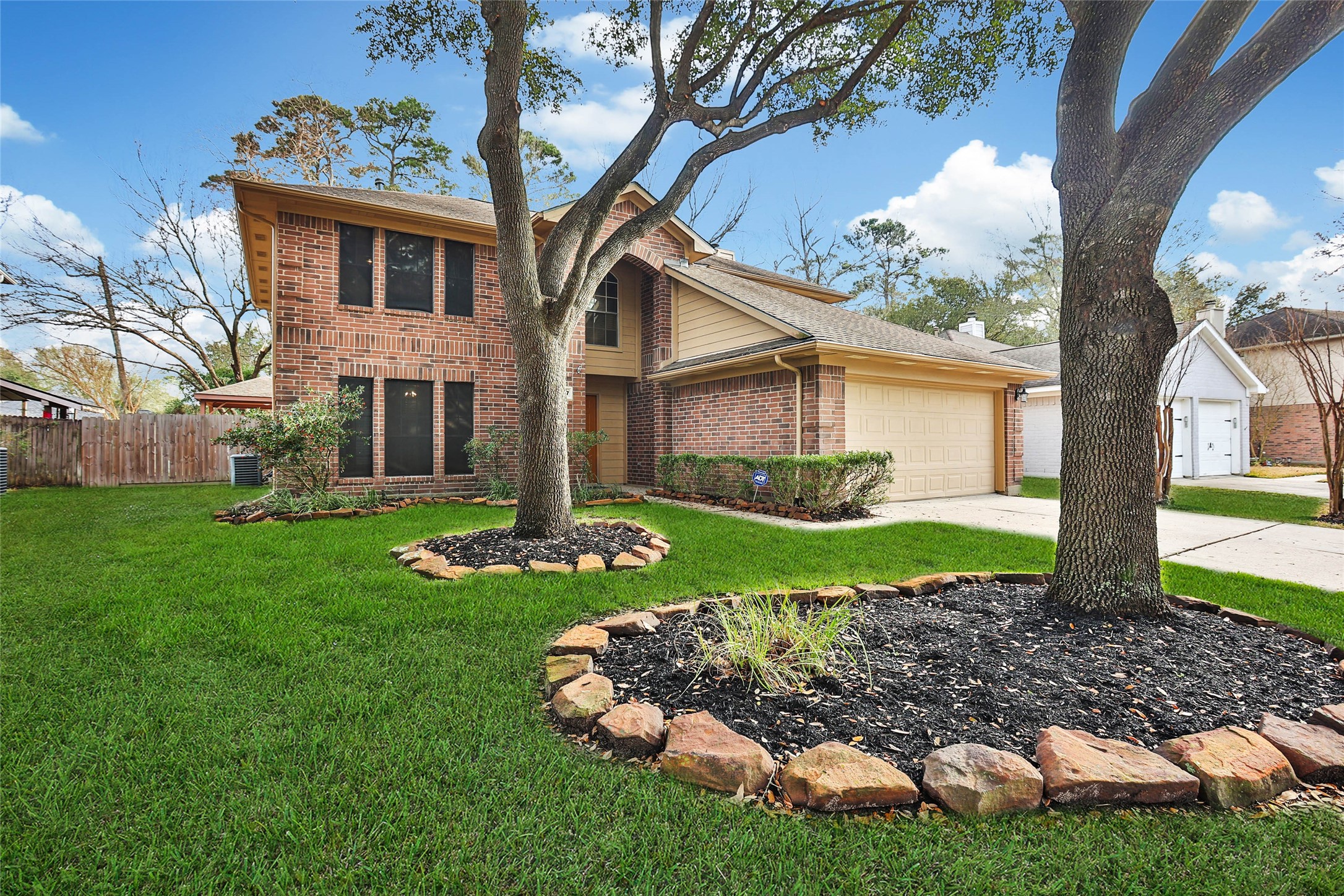 1427 Redwood Village Circle Spring, TX 77386 - Photo 2 of 43 a front view of a house with garden