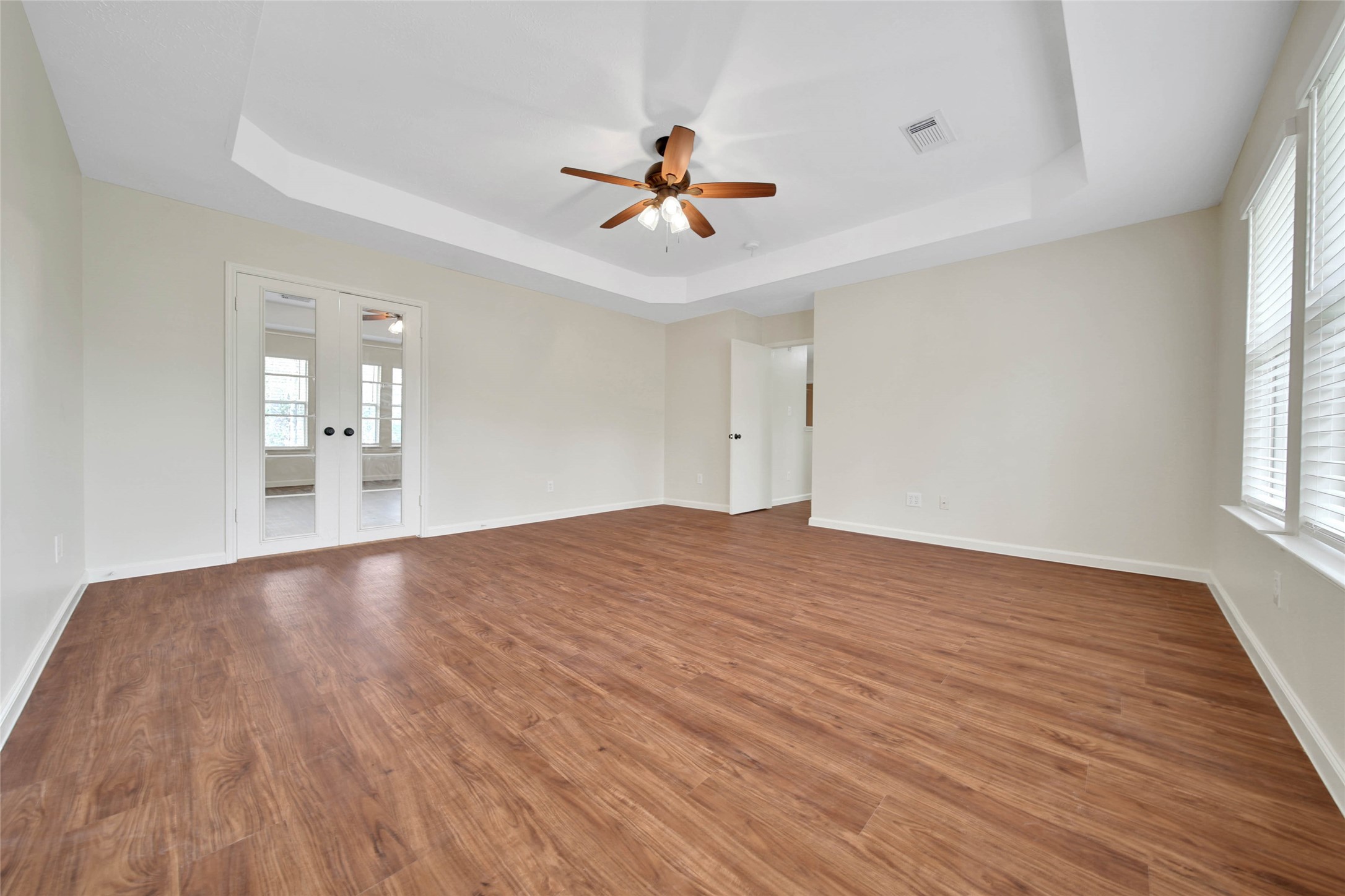 1427 Redwood Village Circle Spring, TX 77386 - Photo 31 of 43 a view of empty room with wooden floor and fan