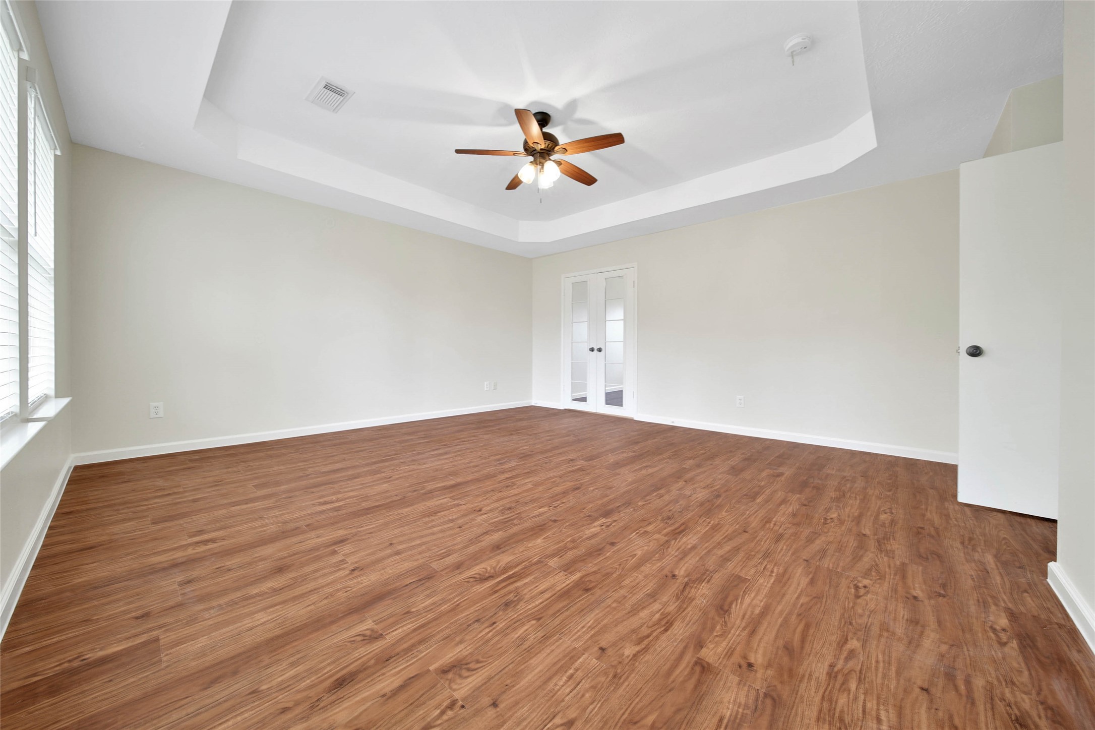 1427 Redwood Village Circle Spring, TX 77386 - Photo 32 of 43 wooden floor in an empty room with a window