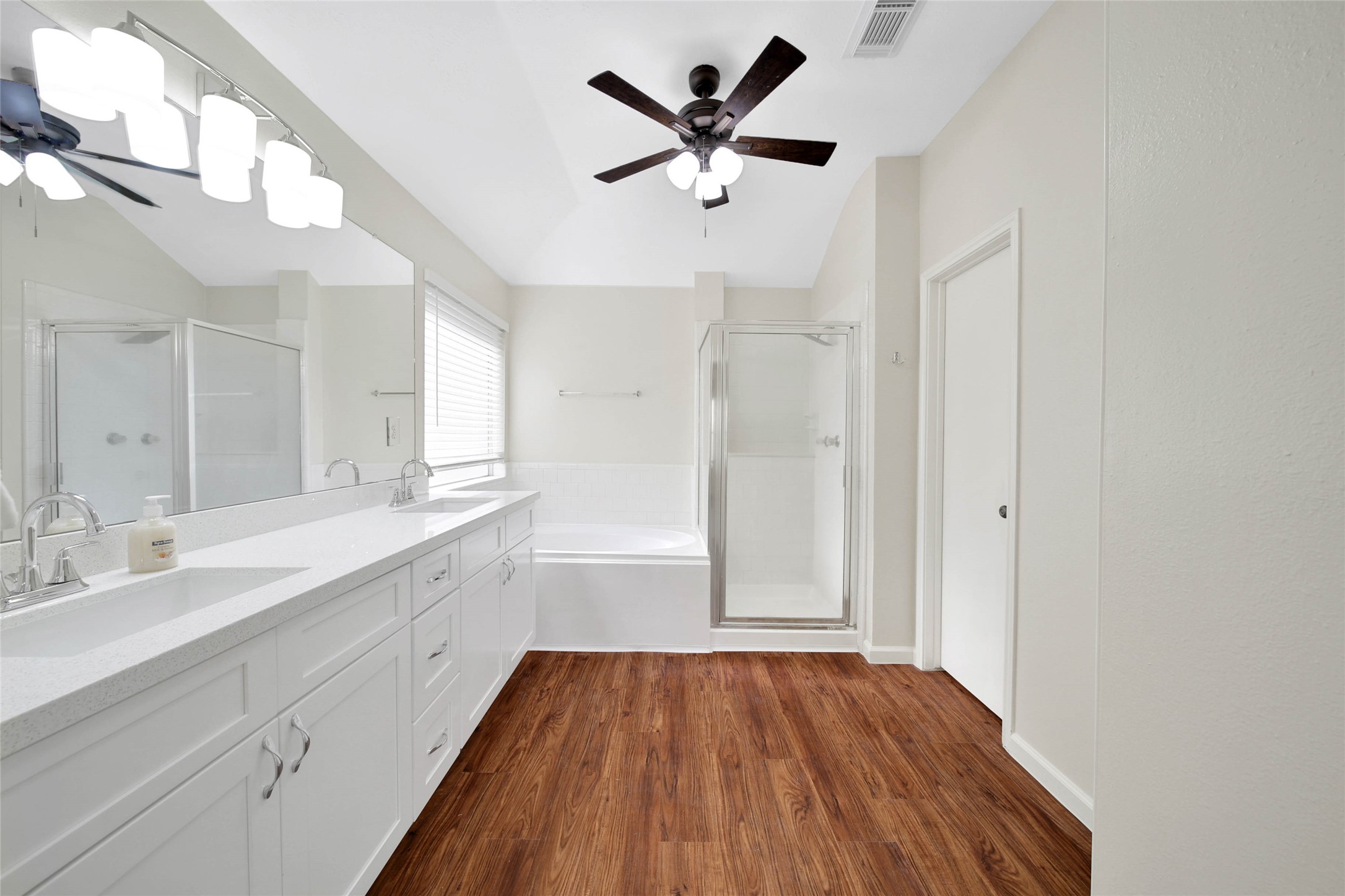 1427 Redwood Village Circle Spring, TX 77386 - Photo 36 of 43 a spacious bathroom with a granite countertop sink a mirror and a shower