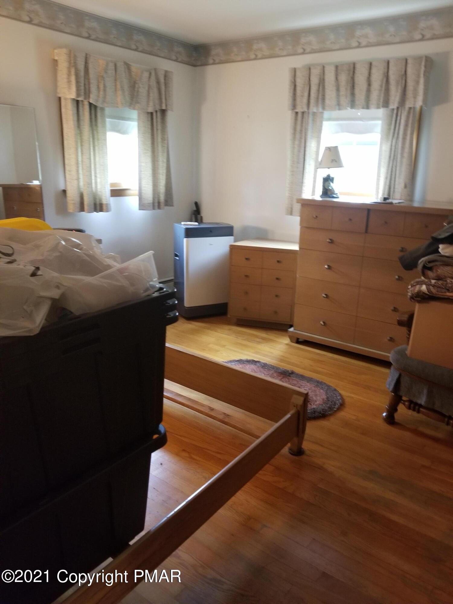 1111 Hillcrest Drive Stroudsburg, PA 18360 - Photo 14 of 20 a living room with a bed furniture and a window