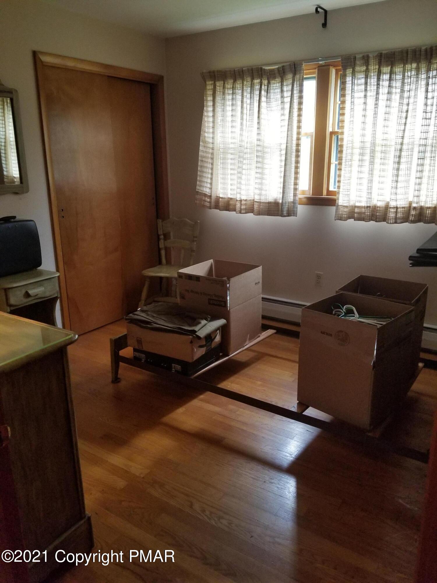 1111 Hillcrest Drive Stroudsburg, PA 18360 - Photo 16 of 20 a living room with furniture and a window