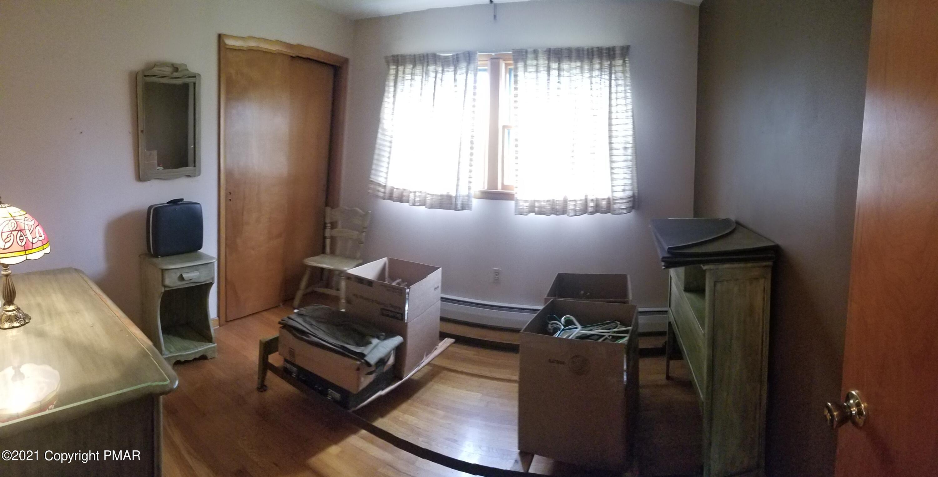 1111 Hillcrest Drive Stroudsburg, PA 18360 - Photo 17 of 20 a living room with furniture and a window