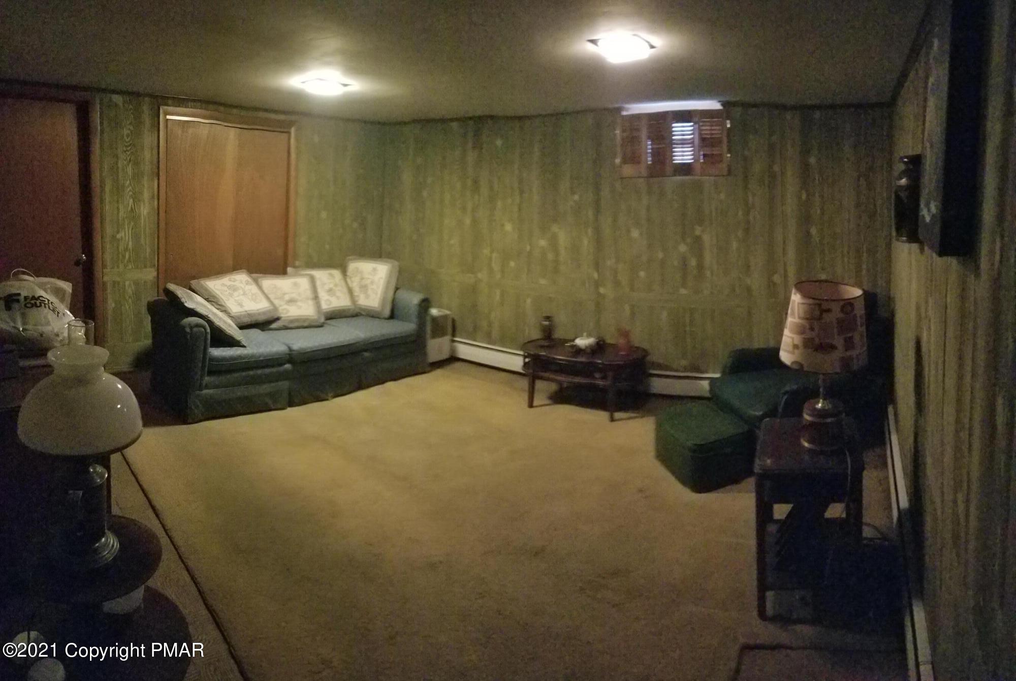 1111 Hillcrest Drive Stroudsburg, PA 18360 - Photo 20 of 20 a living room with furniture and a rug