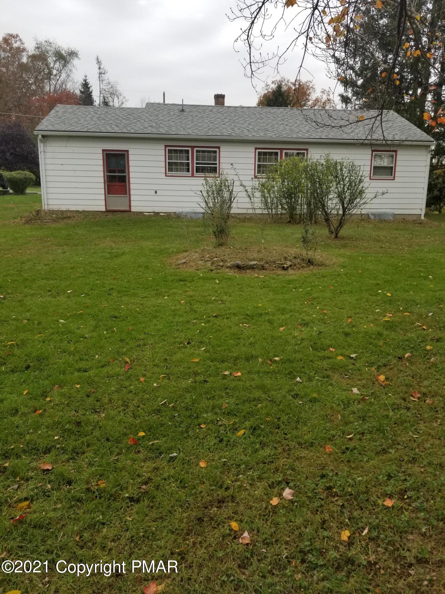 1111 Hillcrest Drive Stroudsburg, PA 18360 - Photo 5 of 20 a view of a yard in front of a house with large trees