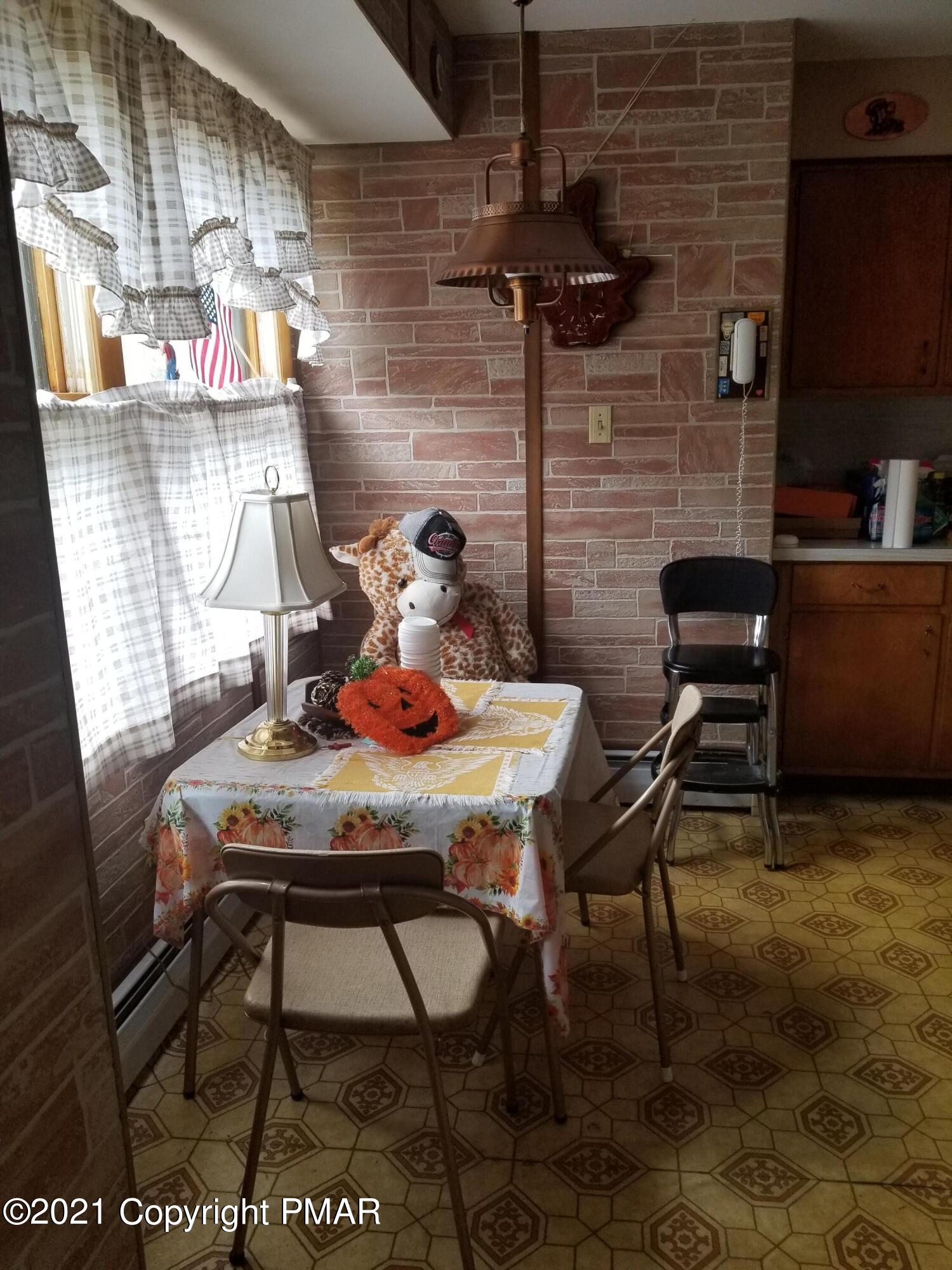 1111 Hillcrest Drive Stroudsburg, PA 18360 - Photo 7 of 20 a view of a room that has a table and chairs in it