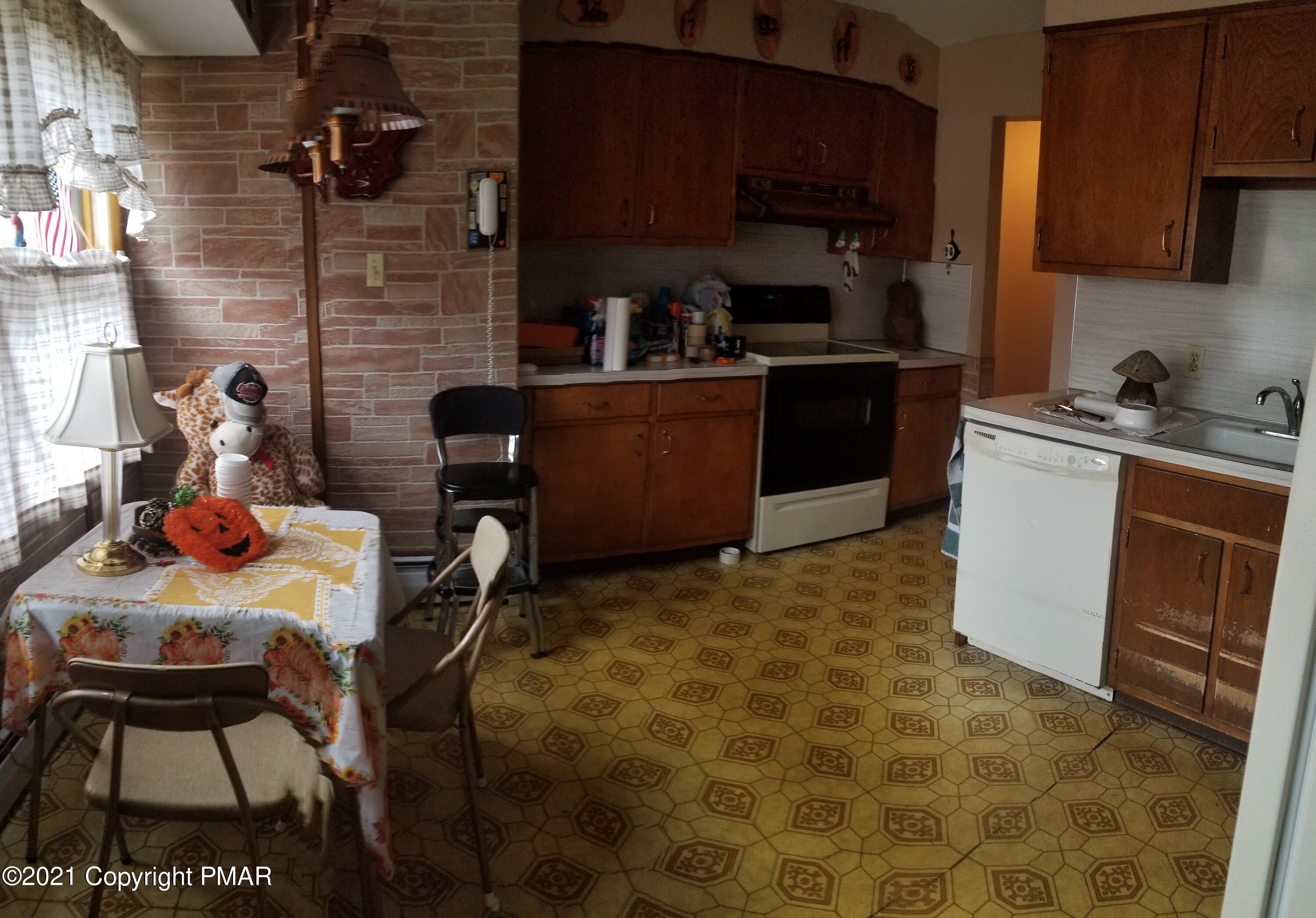1111 Hillcrest Drive Stroudsburg, PA 18360 - Photo 9 of 20 a kitchen with a sink appliances and cabinets