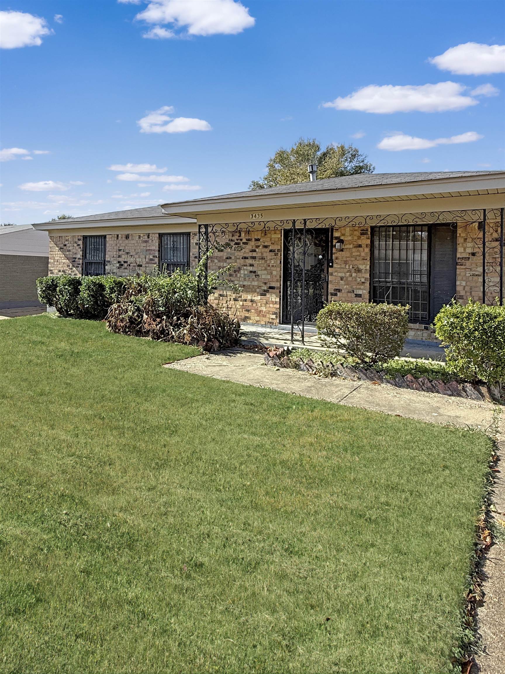 a view of a house with garden and porch
